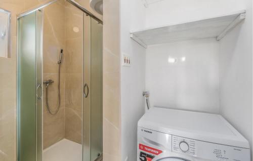 a bathroom with a shower and a washing machine at Awesome Home In Segotici in Šegotići