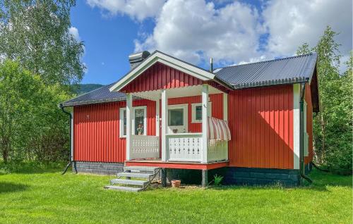 a small red house with a porch and stairs at 4 Bedroom Amazing Home In Sysslebäck in Sysslebäck