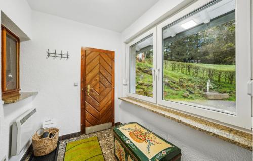 a room with a door and a window at Awesome Home In Schleusingen With Sauna in Schleusingen