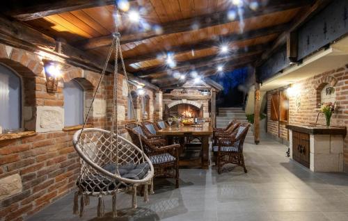 a dining room with a table and chairs at Awesome Home In Zigrovec With Sauna in Sveti Ilija