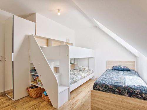a bedroom with a bed and a white bunk room at Appartement familial à 250m du golf et de la plage, parking inclus - Varaville - FR-1-788-16 in Varaville