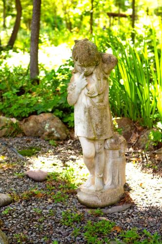 a statue of a little girl holding a bucket at Beautiful Parkside Suite in Saint James
