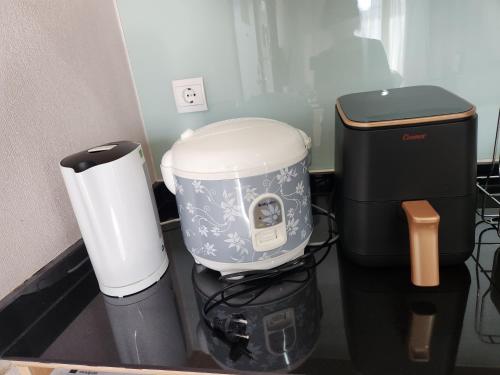 a coffee maker and a coffeemaker on a counter at Menteng Park - Tower Diamond, 2 Bed Rooms, Private Lift in Jakarta