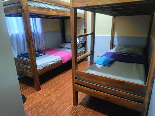 a couple of bunk beds in a room at Sevene Transient Inn in Puerto Princesa City