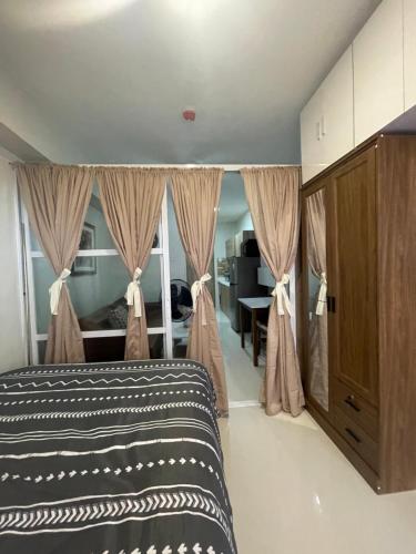 Postel nebo postele na pokoji v ubytování Yvonne Condo at Primeworld Lapu Lapu, Mactan Cebu