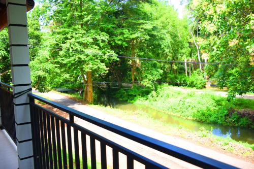 a view of a river from a balcony at Sasanda Villa and Yala Safari Place in Tissamaharama