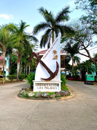 a sign for the university of las palmas at Sandy Shore Two Bedroom Condo Across Beach in Coco