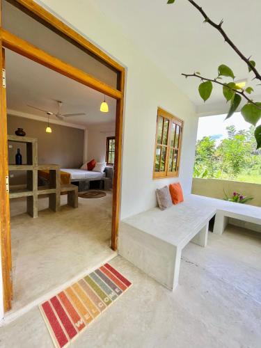 a living room with a couch and a window at Kandy Living Homestay in Kandy