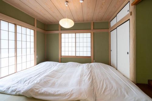 Postel nebo postele na pokoji v ubytování Max11名宿泊可能 一軒家を丸ごと貸切 BBQ可能 ファミリー歓迎 ANGO NASU I