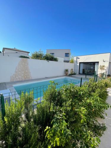 a view of a swimming pool in a house at L’Oliveraie in Narbonne