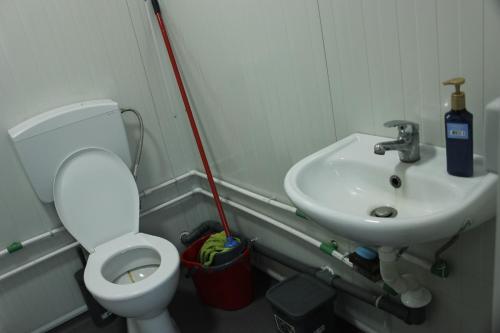 a bathroom with a toilet and a sink at Mahane in Tirana