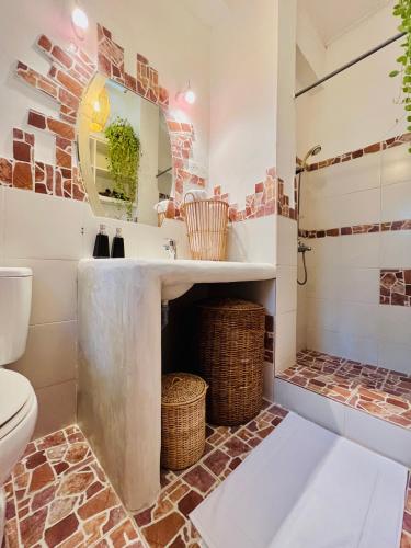 a bathroom with a sink and a toilet at Kandy Living Homestay in Kandy