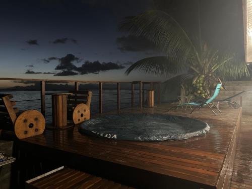 a hot tub on the deck of a cruise ship at Studio Tahatai Paea in Paea