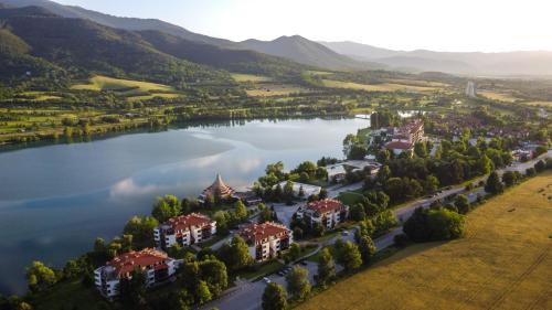 an aerial view of a village on a lake at Pravets Lake Panorama Apartments in Pravets
