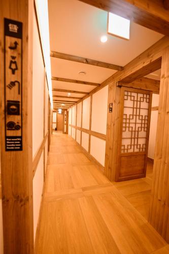 a hallway with a door in a japanese room at Hanok Hotel DAAM Seoul in Seoul