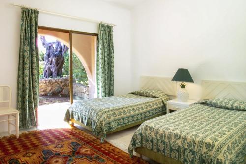 En eller flere senge i et værelse på Lageado Park