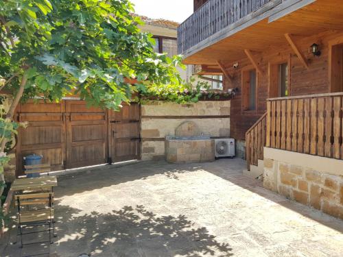 a patio of a house with a wooden fence at Villa Nikoli in Nesebar