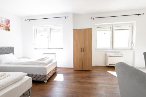 Postel nebo postele na pokoji v ubytování Luna Nera apartments