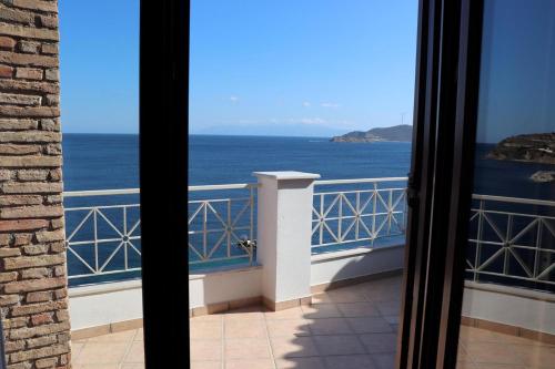 a view of the ocean from a balcony at Aegean View in Áyioi Apóstoloi