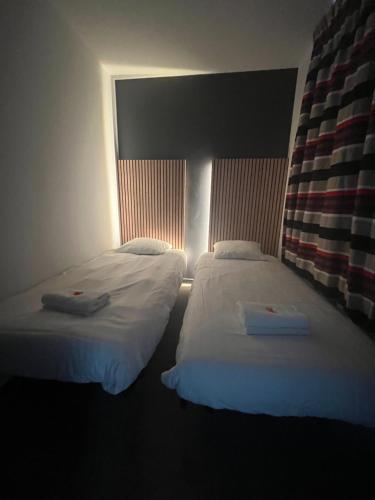 Una cama o camas en una habitación de L'Inattendu Appart Dinant Centre