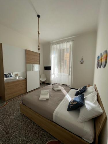 a bedroom with a large bed in a room at Il Delfino d'Oro in Savona