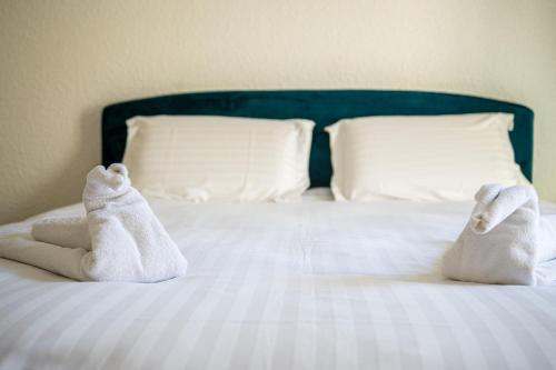 Postel nebo postele na pokoji v ubytování Le 42-GregIMMO-Appart'Hôtel