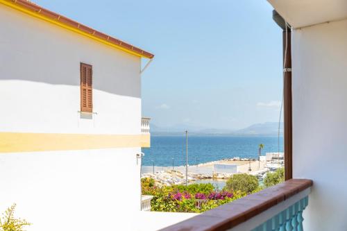 a view of the ocean from the balcony of a house at Casa Calasetta sul porto in Calasetta