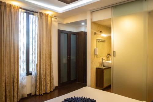 Katil atau katil-katil dalam bilik di Mystic Apartotel Hebbal