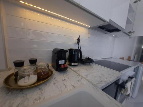 a kitchen with a counter with a coffee maker on it at House B Diavata, Thessaloniki in Thessaloniki