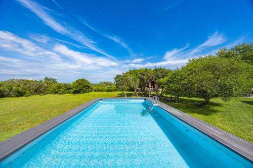 a swimming pool in the middle of a yard at Holiday house Mirna with swimming pool and jacuzzi in Pula
