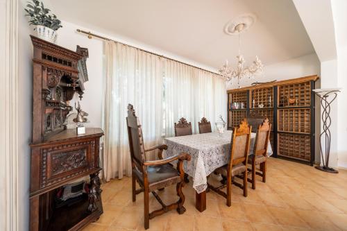 a dining room with a table and chairs at Villa Bella Elana in Jūrmala