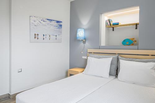 Ένα ή περισσότερα κρεβάτια σε δωμάτιο στο Sergiani Garden Hotel Apartments