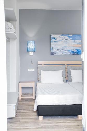 Ένα ή περισσότερα κρεβάτια σε δωμάτιο στο Sergiani Garden Hotel Apartments