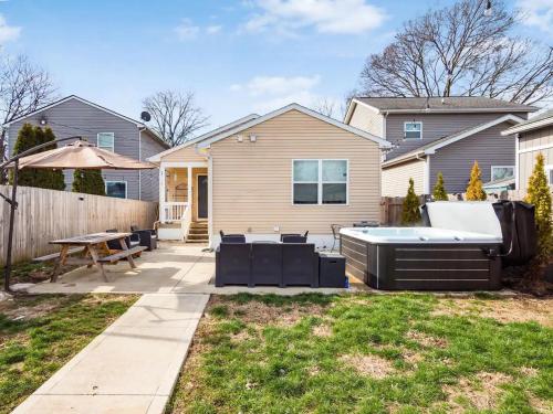 a backyard with a hot tub and a patio at Urban Oasis w Hot Tub Near Downtown & Arena District in Columbus