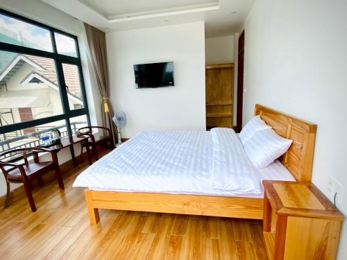 Postel nebo postele na pokoji v ubytování MH Villa DaLat