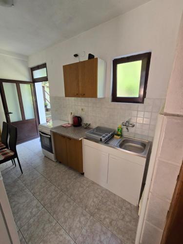 a kitchen with a sink and a counter top at Villa Kralj Mljet in Saplunara