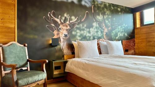 Katil atau katil-katil dalam bilik di Alpen Lodge Riezlern