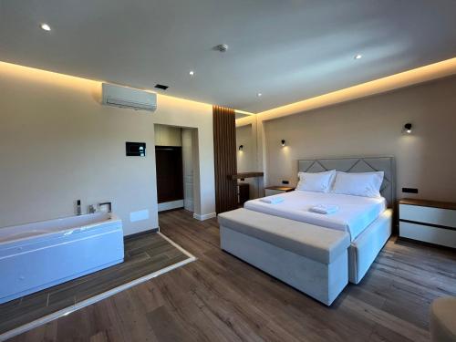 Postel nebo postele na pokoji v ubytování Hotel Vila Ami