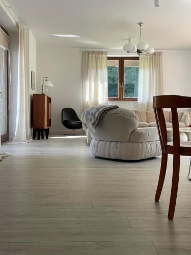 a living room with a couch and a table at Blisko me in Wieprz