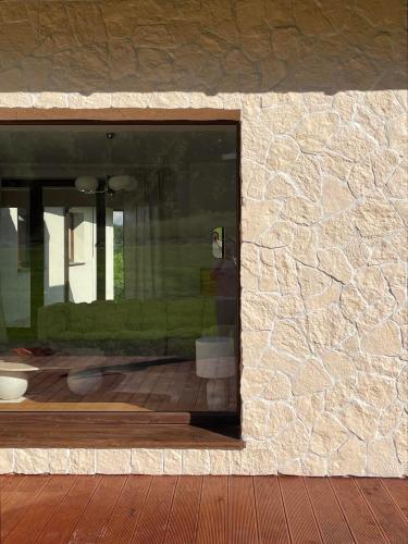 a window of a building with a stone wall at Blisko me in Wieprz