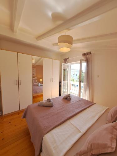 Postel nebo postele na pokoji v ubytování Apartments Nicole