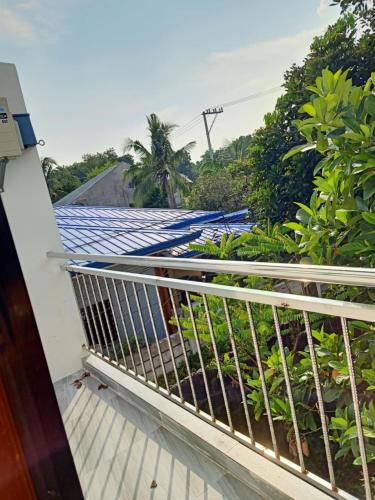 a view from the balcony of a house with a roof at MGM Guest House in San Felix