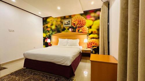 Postel nebo postele na pokoji v ubytování Star Dahlia Hotel