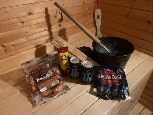 a table with a group of drinks and a bucket of beer at Vingårdens Bed & Breakfast in Helsingborg