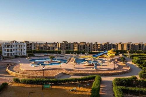 a large park with a skate park with a slide at Two bedroom Chalet in Golden Beach Ras Sedr Fully Air conditioned in front of the pool near the beach kids aqua kids areas family cafeteria in Ras Sedr
