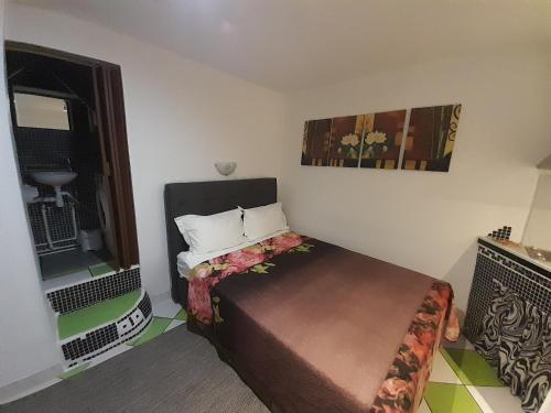 a small room with a bed and a window at Split studio Irisha in Split