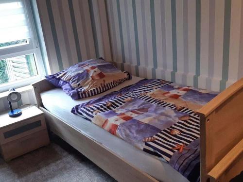 a bed in a room with two twin beds at Neeb Comfortable holiday residence in Gammendorf