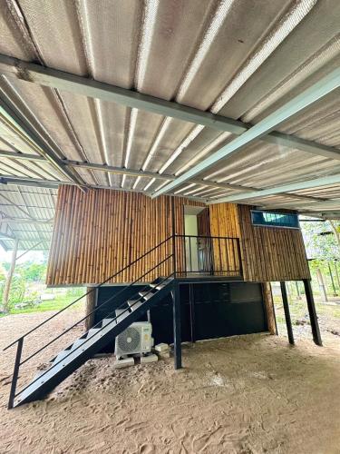 a building with a staircase in the middle of it at The Forest - Sell the Experience in Pai