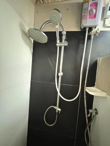 a shower with a shower head in a bathroom at The Forest - Sell the Experience in Pai