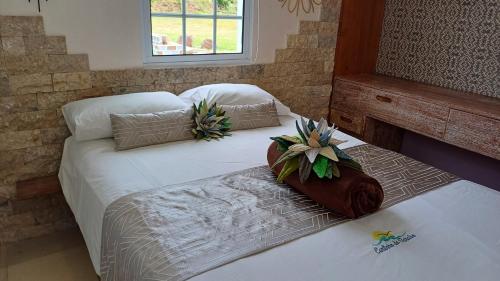 Ένα ή περισσότερα κρεβάτια σε δωμάτιο στο Casita - Cantinho do Paraíso
